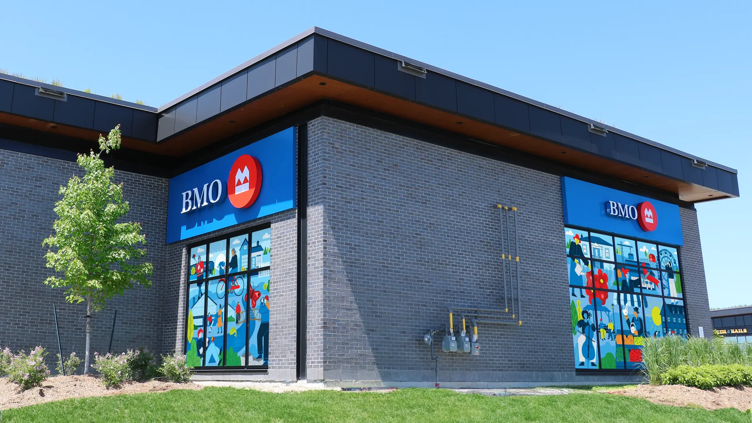 Murals on the side of a BMO bank building